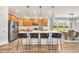 Spacious kitchen with a large island, pendant lighting, stainless steel appliances, and an open dining area at 402 Sun Colony Blvd., Longs, SC 29568