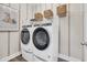 Convenient laundry room with front-load washer and dryer, shelving, and modern finishes at 402 Sun Colony Blvd., Longs, SC 29568