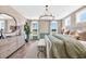 Charming main bedroom showcasing view, a stylish rug, and accent wall at 402 Sun Colony Blvd., Longs, SC 29568