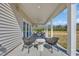 Covered patio with outdoor seating area, ceiling fan, and open yard views at 402 Sun Colony Blvd., Longs, SC 29568