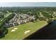 Aerial view of townhomes on golf course near a pond, with skyline in background at 4046 Fairway Lakes Dr. # 4046, Myrtle Beach, SC 29579