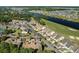 Aerial view of townhomes beside a waterway, golf course, and lush green landscaping at 4046 Fairway Lakes Dr. # 4046, Myrtle Beach, SC 29579