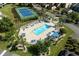 Aerial view featuring a community pool, tennis court and manicured grounds at 4046 Fairway Lakes Dr. # 4046, Myrtle Beach, SC 29579