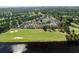 An aerial view of townhomes, a golf course, and lake front property in a coastal community at 4046 Fairway Lakes Dr. # 4046, Myrtle Beach, SC 29579