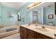 Bathroom featuring a double vanity, soaking tub, and soft lighting, creating a serene and luxurious atmosphere at 4046 Fairway Lakes Dr. # 4046, Myrtle Beach, SC 29579