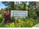 Welcoming Fairway Lakes community sign surrounded by lush greenery and colorful flowers at 4046 Fairway Lakes Dr. # 4046, Myrtle Beach, SC 29579