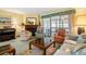 Inviting living room featuring a fireplace, piano and comfortable seating arrangements at 4046 Fairway Lakes Dr. # 4046, Myrtle Beach, SC 29579
