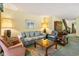 Inviting living room with plush seating, complemented by warm lighting, and classic wood accents at 4046 Fairway Lakes Dr. # 4046, Myrtle Beach, SC 29579