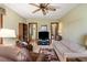 Cozy living room featuring neutral walls, ceiling fan, comfortable seating, and access to other areas at 4046 Fairway Lakes Dr. # 4046, Myrtle Beach, SC 29579