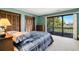 Comfortable main bedroom with a sliding glass doors that lead to a private balcony and scenic views at 4046 Fairway Lakes Dr. # 4046, Myrtle Beach, SC 29579
