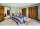 A cozy main bedroom featuring wooden closets, neutral-toned walls, and access to an attached bathroom at 4046 Fairway Lakes Dr. # 4046, Myrtle Beach, SC 29579