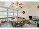 Bright sunroom featuring plenty of windows and a ceiling fan at 4046 Fairway Lakes Dr. # 4046, Myrtle Beach, SC 29579