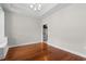 Dining room features wood flooring and an elegant light fixture at 4067 Ridgewood Dr., Conway, SC 29526