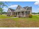 Charming brick home with symmetrical facade, shutters, and well-manicured front lawn at 4067 Ridgewood Dr., Conway, SC 29526