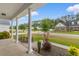 Inviting front porch framed by classic columns and landscaped flower beds, offering curb appeal at 4067 Ridgewood Dr., Conway, SC 29526