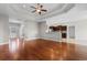 Open-concept living area with hardwood floors, a tray ceiling and natural light to kitchen at 4067 Ridgewood Dr., Conway, SC 29526
