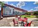 Outdoor seating near a vibrant mural that captures local history at 4067 Ridgewood Dr., Conway, SC 29526