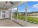 Enclosed porch with panoramic backyard and pond views, offering a serene retreat at 4067 Ridgewood Dr., Conway, SC 29526
