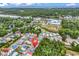 Aerial view showcasing colorful beach houses, lush greenery, a river, and the skyline in the distance at 4341 Grande Harbour Blvd., Little River, SC 29566