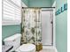 Bathroom featuring a glass shower, toilet, and stylish tropical themed curtain, and granite sink at 4341 Grande Harbour Blvd., Little River, SC 29566