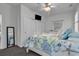Bedroom with decorative mirror, television, and closet with white double doors, for added storage space at 4341 Grande Harbour Blvd., Little River, SC 29566