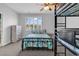 Bedroom featuring a bunkbed, ceiling fan, bright window and decorative bedspread and side table at 4341 Grande Harbour Blvd., Little River, SC 29566