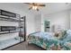 Bedroom featuring a bunkbed and queen bed adjacent to a bathroom and dresser at 4341 Grande Harbour Blvd., Little River, SC 29566
