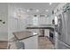 Well-lit kitchen featuring stainless steel appliances and white cabinetry at 4341 Grande Harbour Blvd., Little River, SC 29566