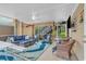Beautifully designed screened in porch with comfortable seating, ceiling fan and access to upper level at 4341 Grande Harbour Blvd., Little River, SC 29566