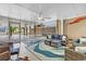 Beautifully designed screened in porch with comfortable seating, ceiling fan and access to upper level at 4341 Grande Harbour Blvd., Little River, SC 29566