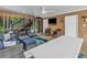 Beautifully designed screened in porch with comfortable seating, ceiling fan and access to upper level at 4341 Grande Harbour Blvd., Little River, SC 29566