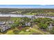 Expansive aerial view of a condo surrounded by lush greenery, waterways, and a golf course at 4429 Turtle Ln. # 3A, Little River, SC 29566