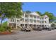 Charming multi-story condo building with multiple decks, enhanced by well-maintained landscaping and convenient parking at 4429 Turtle Ln. # 3A, Little River, SC 29566