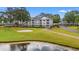 Picturesque condo set on a golf course, offering serene views of lush greenery and a tranquil pond at 4429 Turtle Ln. # 3A, Little River, SC 29566