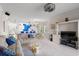 Open-concept living room with plush sofa, dining area, and bright kitchen in the background at 4429 Turtle Ln. # 3A, Little River, SC 29566