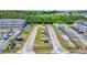 Aerial view of boat storage area with several vessels, surrounded by trees and buildings at 4522 N Plantation Harbour Dr. # E-3, Little River, SC 29566
