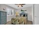 Bedroom with a ceiling fan, surf decor, and window with plantation shutters at 4522 N Plantation Harbour Dr. # E-3, Little River, SC 29566