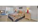 Bright bedroom featuring plantation shutters and nautical decor at 4522 N Plantation Harbour Dr. # E-3, Little River, SC 29566