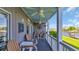 Charming outdoor patio features comfortable seating, ceiling fans, and views of the waterfront at 4522 N Plantation Harbour Dr. # E-3, Little River, SC 29566