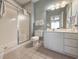 Bathroom featuring walk-in shower, white vanity with sink, and tile flooring at 4532 Girvan Dr. # A, Myrtle Beach, SC 29579