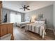 Comfortable bedroom with two beds, wood floors, ceiling fan and lots of natural light at 4532 Girvan Dr. # A, Myrtle Beach, SC 29579