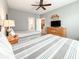 Bedroom with two beds, wooden dresser, and access to the kitchen and bathroom at 4532 Girvan Dr. # A, Myrtle Beach, SC 29579