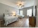 Comfortable bedroom with two beds, ceiling fan, and windows offering natural light at 4532 Girvan Dr. # A, Myrtle Beach, SC 29579