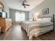Bright bedroom featuring two beds, wood floors, and a ceiling fan at 4532 Girvan Dr. # A, Myrtle Beach, SC 29579