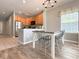 Cozy dining area with table and chairs adjacent to an open concept kitchen with ample natural light at 4532 Girvan Dr. # A, Myrtle Beach, SC 29579