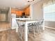 Dining area featuring wood flooring, a gray table and chairs, and natural light at 4532 Girvan Dr. # A, Myrtle Beach, SC 29579
