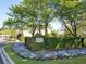 Community entrance with manicured hedges and floral landscaping at 4532 Girvan Dr. # A, Myrtle Beach, SC 29579