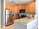 Modern kitchen with granite countertops, stainless steel appliances, and ample cabinet space at 4532 Girvan Dr. # A, Myrtle Beach, SC 29579