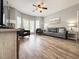 Spacious living room with wood floors, comfortable seating, and lots of natural light at 4532 Girvan Dr. # A, Myrtle Beach, SC 29579