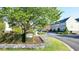 Well-maintained street with landscaped hedges and colorful townhomes at 4532 Girvan Dr. # A, Myrtle Beach, SC 29579